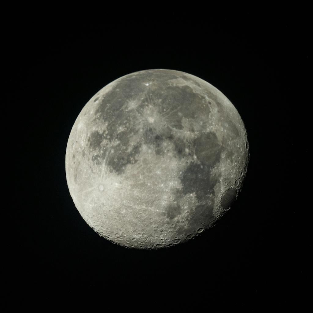High-resolution image of the moon showcasing craters and terrain features.